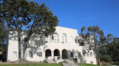 Photo of the front of Wardman Gym with green lawn in the front