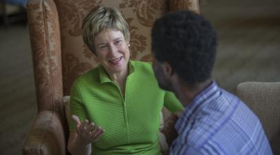 President Herzberger talking to a student