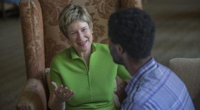 President Herzberger talking to a student