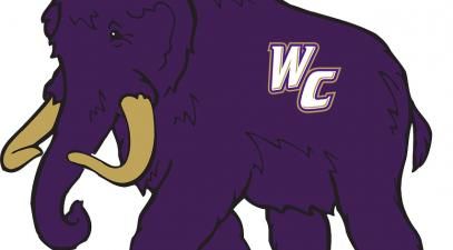 Woolly Whittier, a purple mammoth with gold tusks and a Whittier College logo on its side