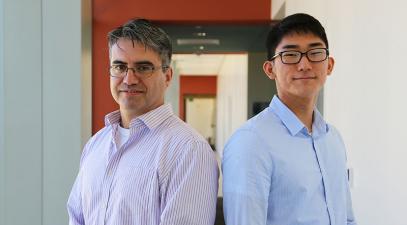 Hector Valenzuela and Brandon Choi in a hallway.