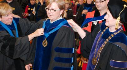 Kathy Barlow receiving the Nerhood Award from Joyce Kaufman