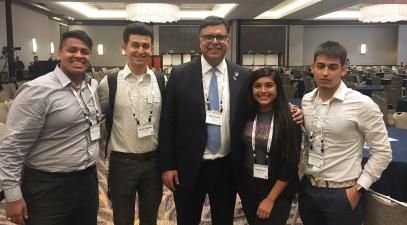 Students pose for a group photo with Gary Acosta.