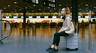 student wearing mask at airport