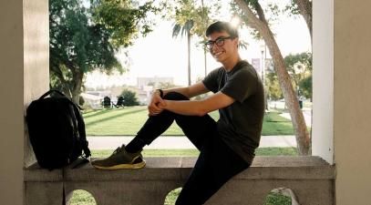 Student sitting in an archway