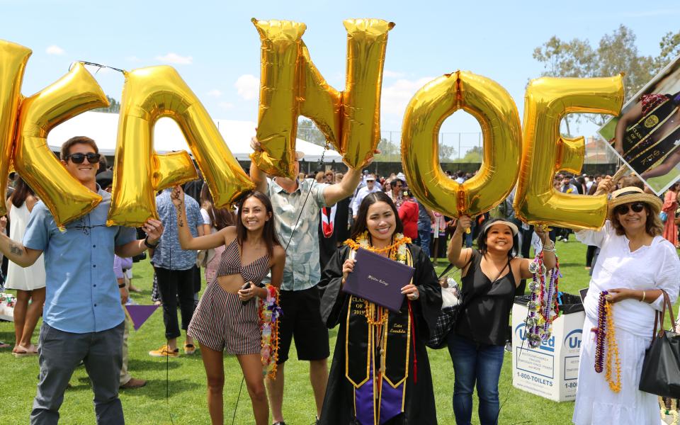 graduate with family