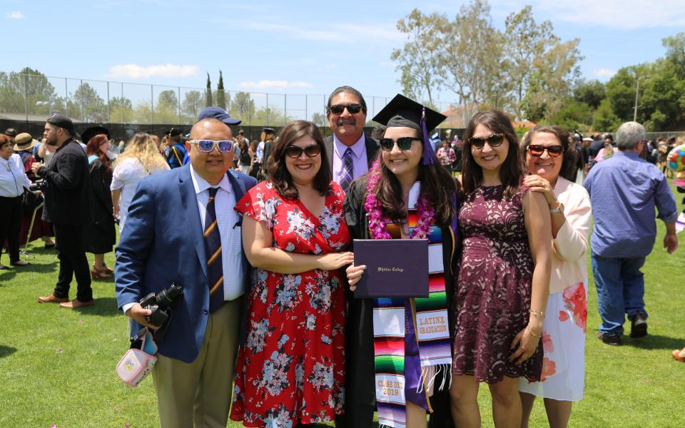 graduate with family