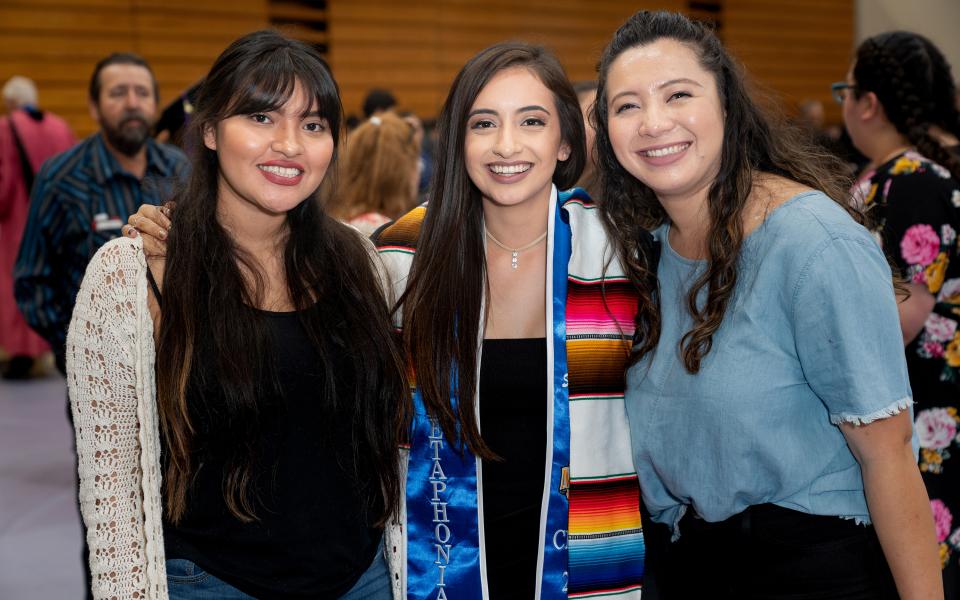 graduate with family/friends