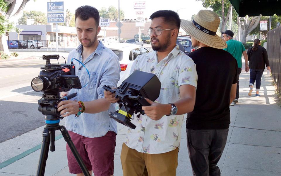 Two people working on an indie film set.