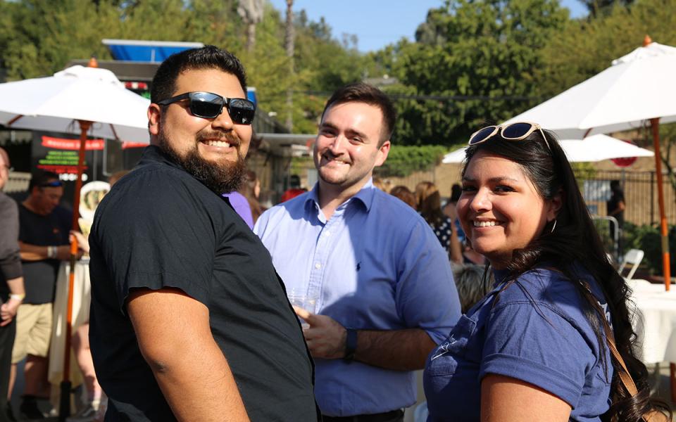 Three people at the Homecoming Festival