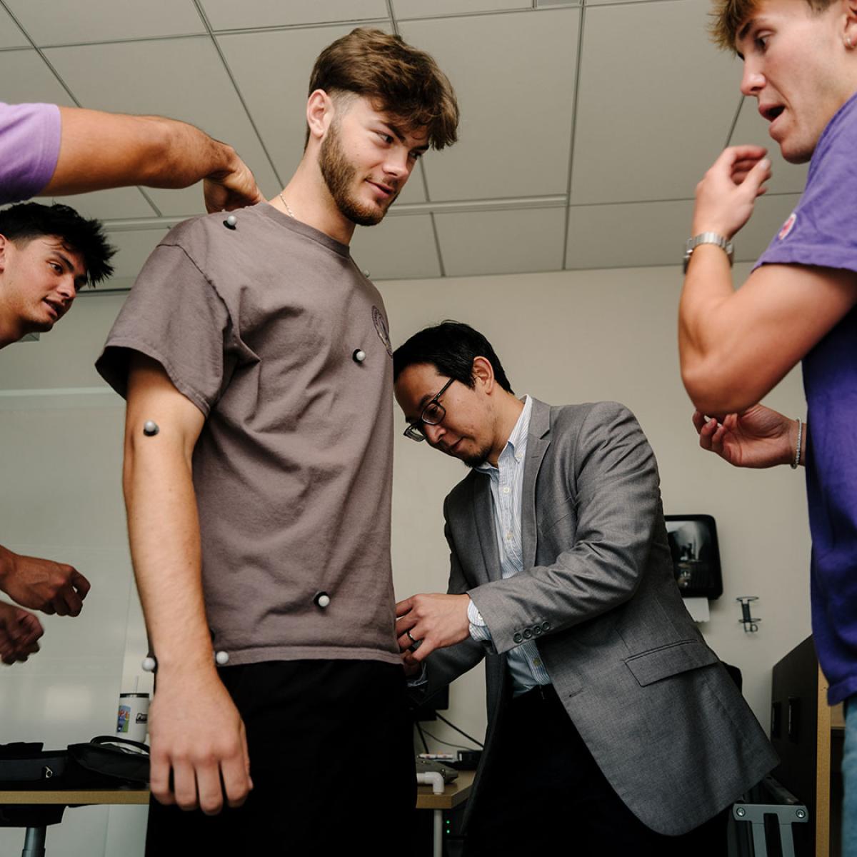 Students and professor in a lab