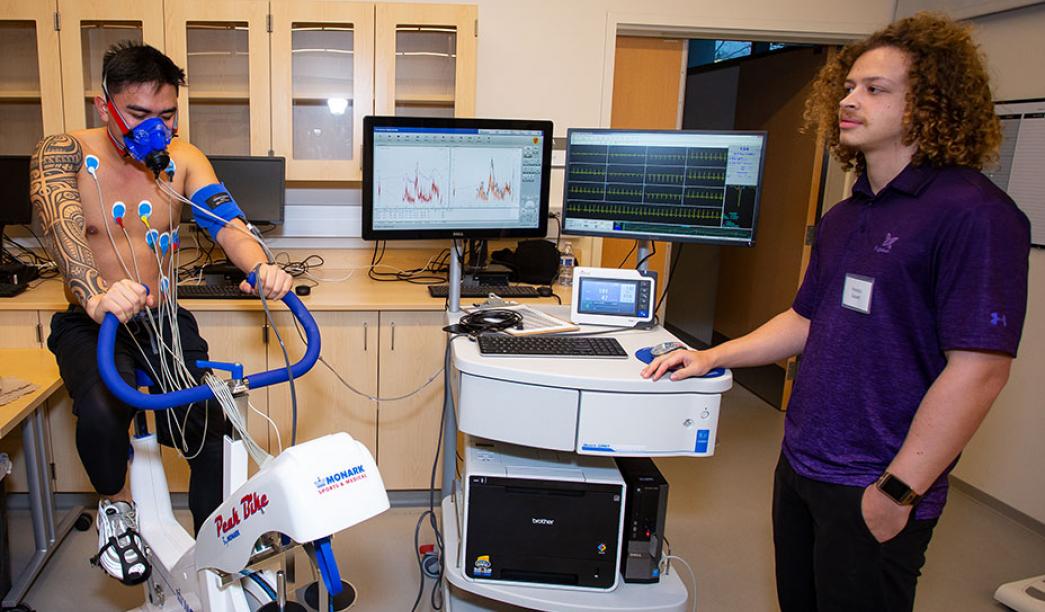 Two students in the kinesiology lab