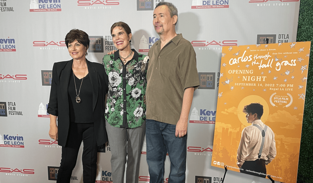Patti McCarthy, Jennifer Holmes, and Rick Dominguez on the red carpet